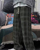 Army green plaid wide-leg pants worn standing, knee to ankle