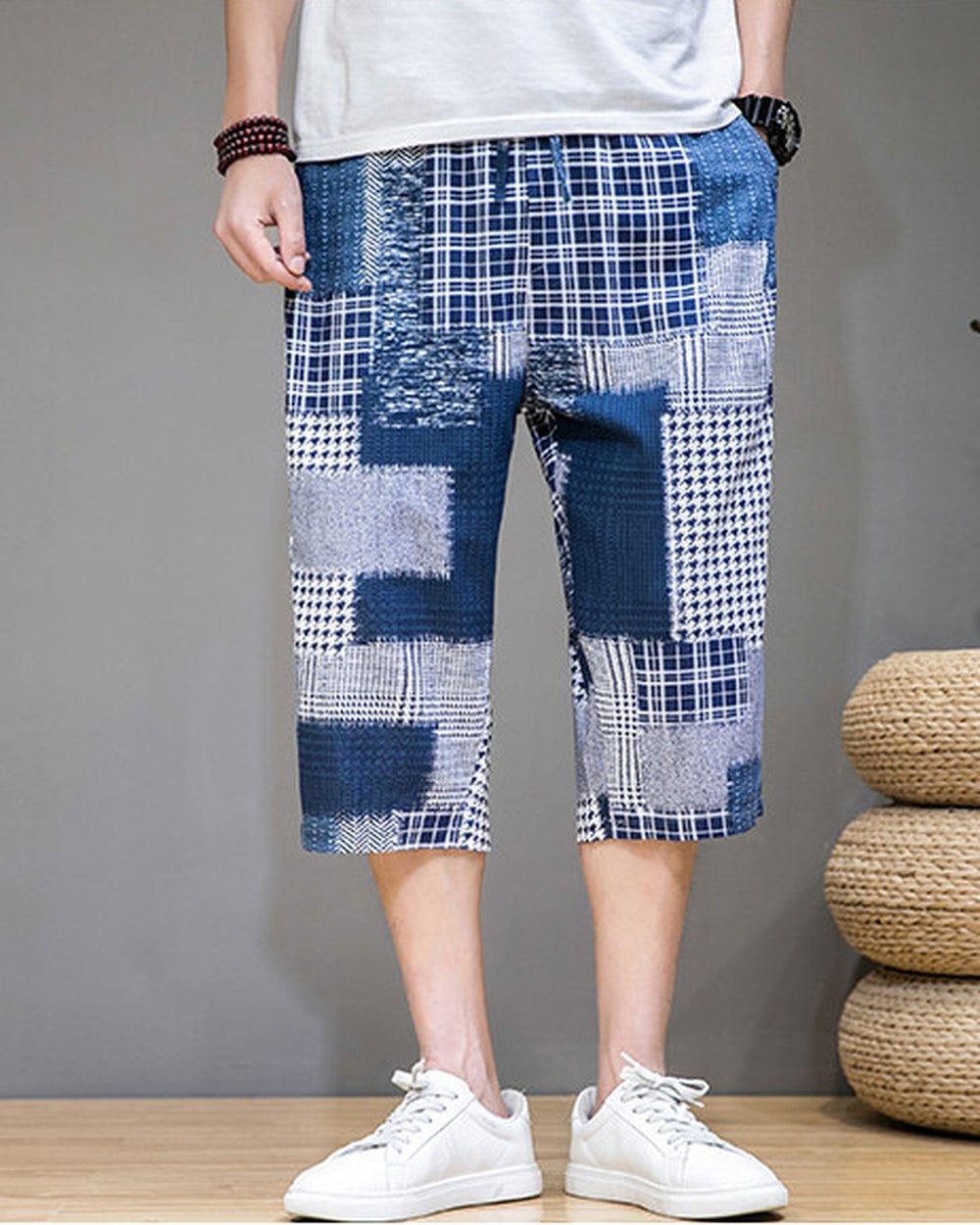 Blue patchwork cropped pants with navy, plaid and houndstooth blocks, front view