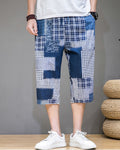 Blue patchwork cropped pants with navy, plaid and houndstooth blocks, front view