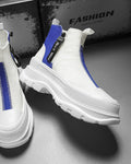 Blue and white platform sneaker boots with a front zip and a NICE MEE pull, a studio pair on a gray floor