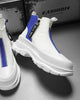 Blue and white platform sneaker boots with a front zip and a NICE MEE pull, a studio pair on a gray floor