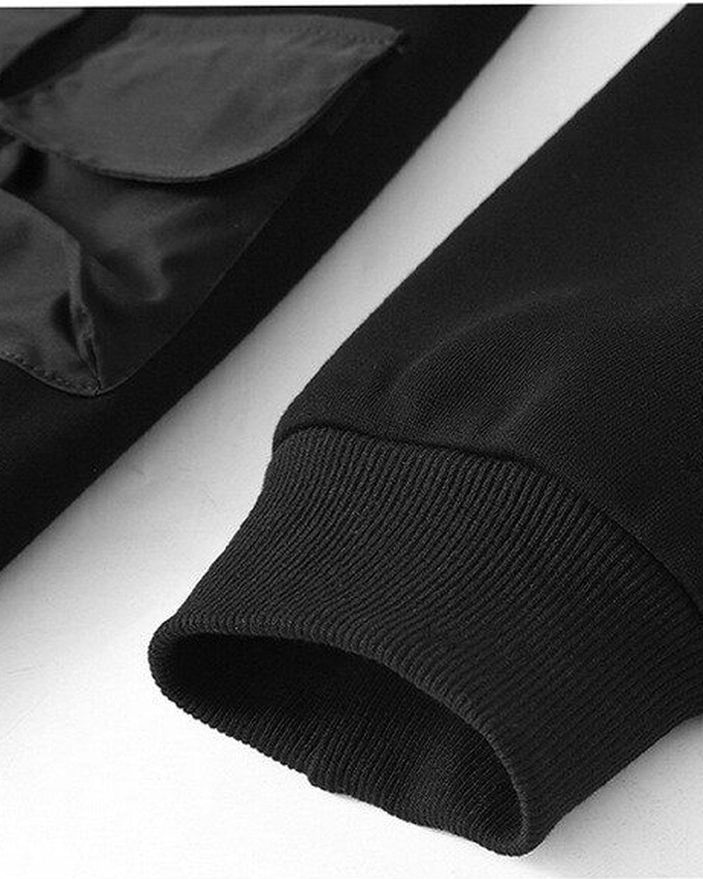 Close-up of the ribbed cuff of the black fleece-lined sweatshirt