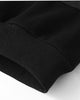 Close-up of the ribbed hem of the black fleece-lined sweatshirt