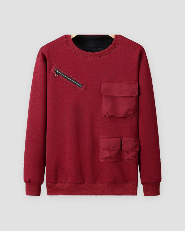 Wine red fleece-lined crewneck sweatshirt with a diagonal chest zip pocket and three flap pockets, front view