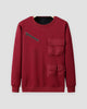 Wine red fleece-lined crewneck sweatshirt with a diagonal chest zip pocket and three flap pockets, front view