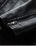 Close-up of the zip on the cuff of the black PU leather jacket