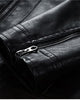 Close-up of the zip on the cuff of the black PU leather jacket