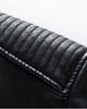 Close-up of the padded shoulder with horizontal ridge stitching on the black PU leather jacket