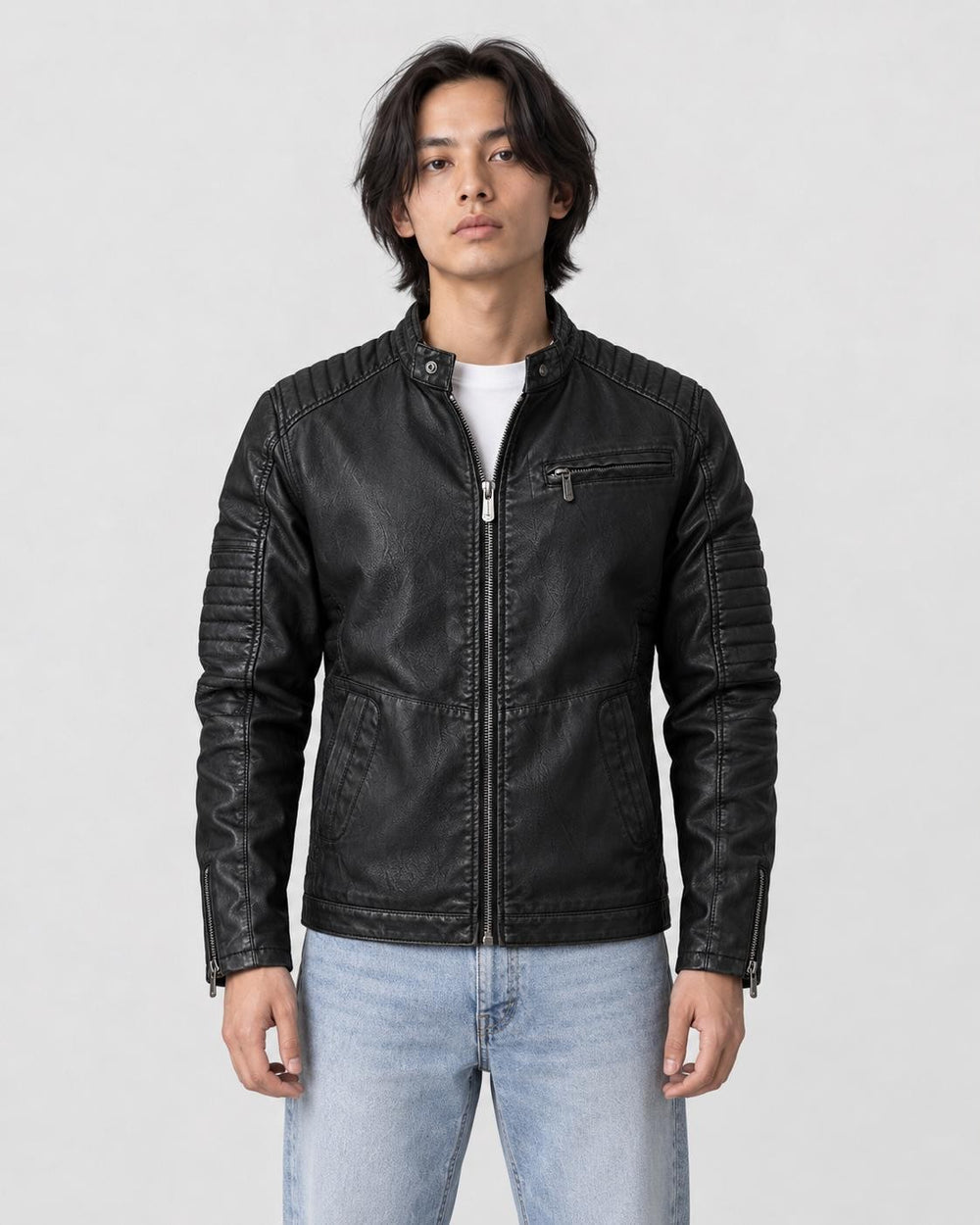 Model wearing the black PU leather biker jacket over a white tee with light jeans, front view