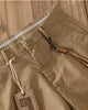 Close-up of the flat waistband, button and fly of the khaki chinos