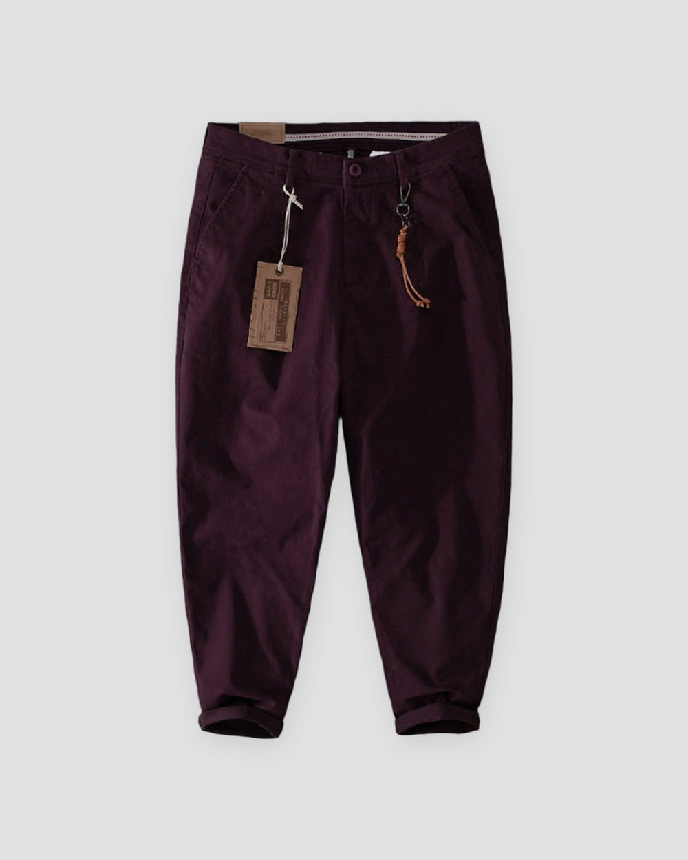 Wine cuffed chinos with a tan cord and snap hook on the belt loop, flat view