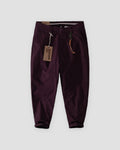 Wine cuffed chinos with a tan cord and snap hook on the belt loop, flat view
