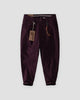 Wine cuffed chinos with a tan cord and snap hook on the belt loop, flat view