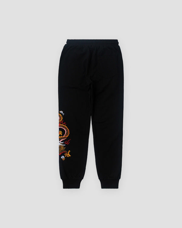 Black joggers, front view, gold dragon embroidered down one leg