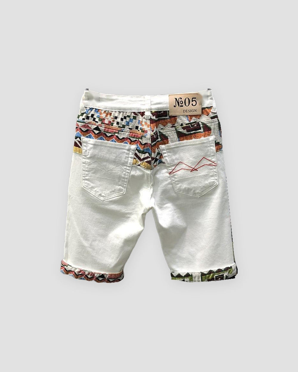 White denim shorts seen from behind with a jacquard yoke, the No.05 DESIGN label and two stitched back pockets