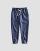 Royal blue striped cropped pants with a cream drawstring and turned-up cuffs, flat view