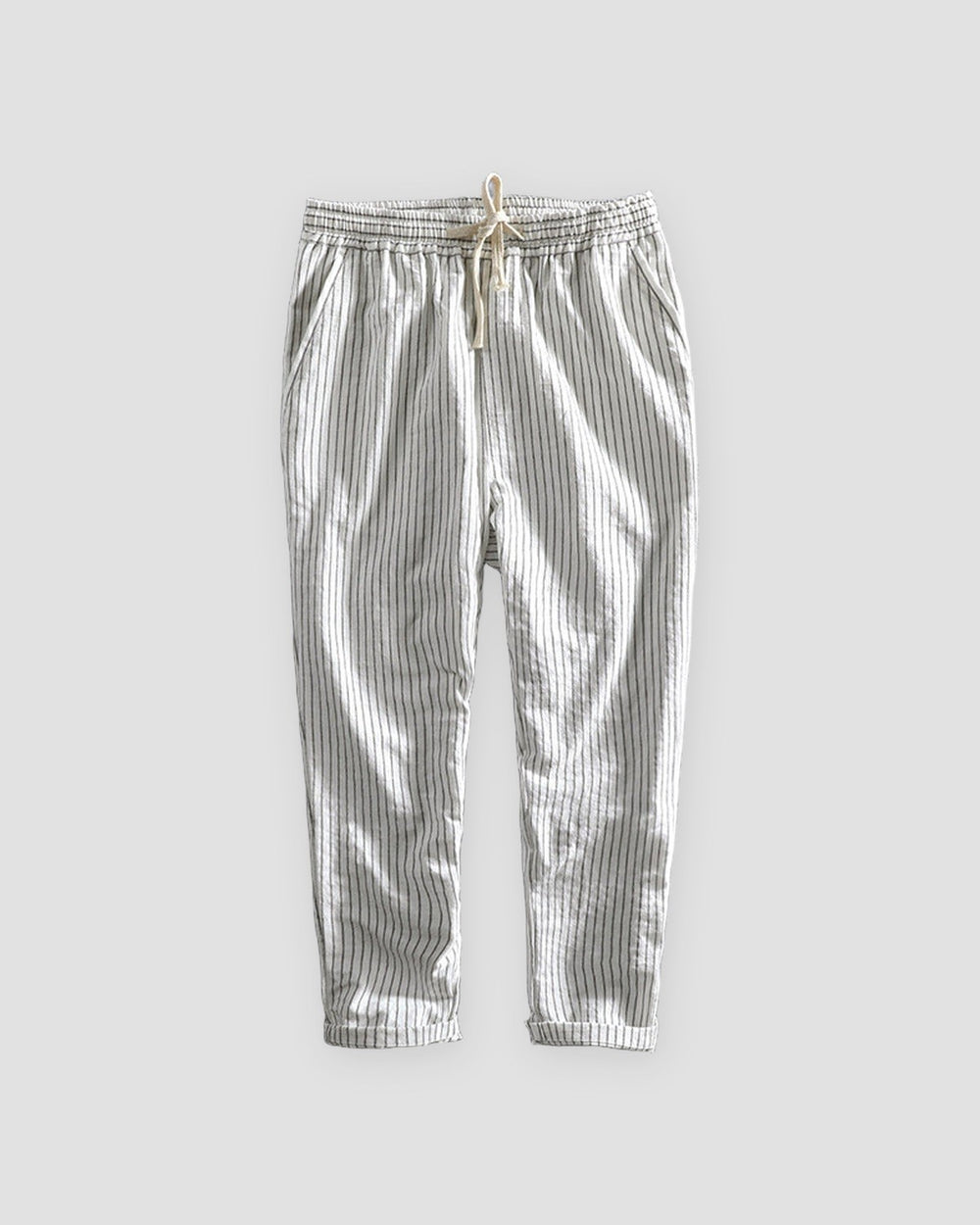 White striped cropped pants with a cream drawstring and turned-up cuffs, flat view