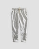 White striped cropped pants with a cream drawstring and turned-up cuffs, flat view