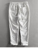Back view of the white striped cropped pants showing the back patch pocket and the turned-up cuffs