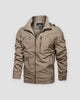 Khaki windbreaker jacket with a stand collar, a chest zip pocket and brown leather-look zip pulls, front view
