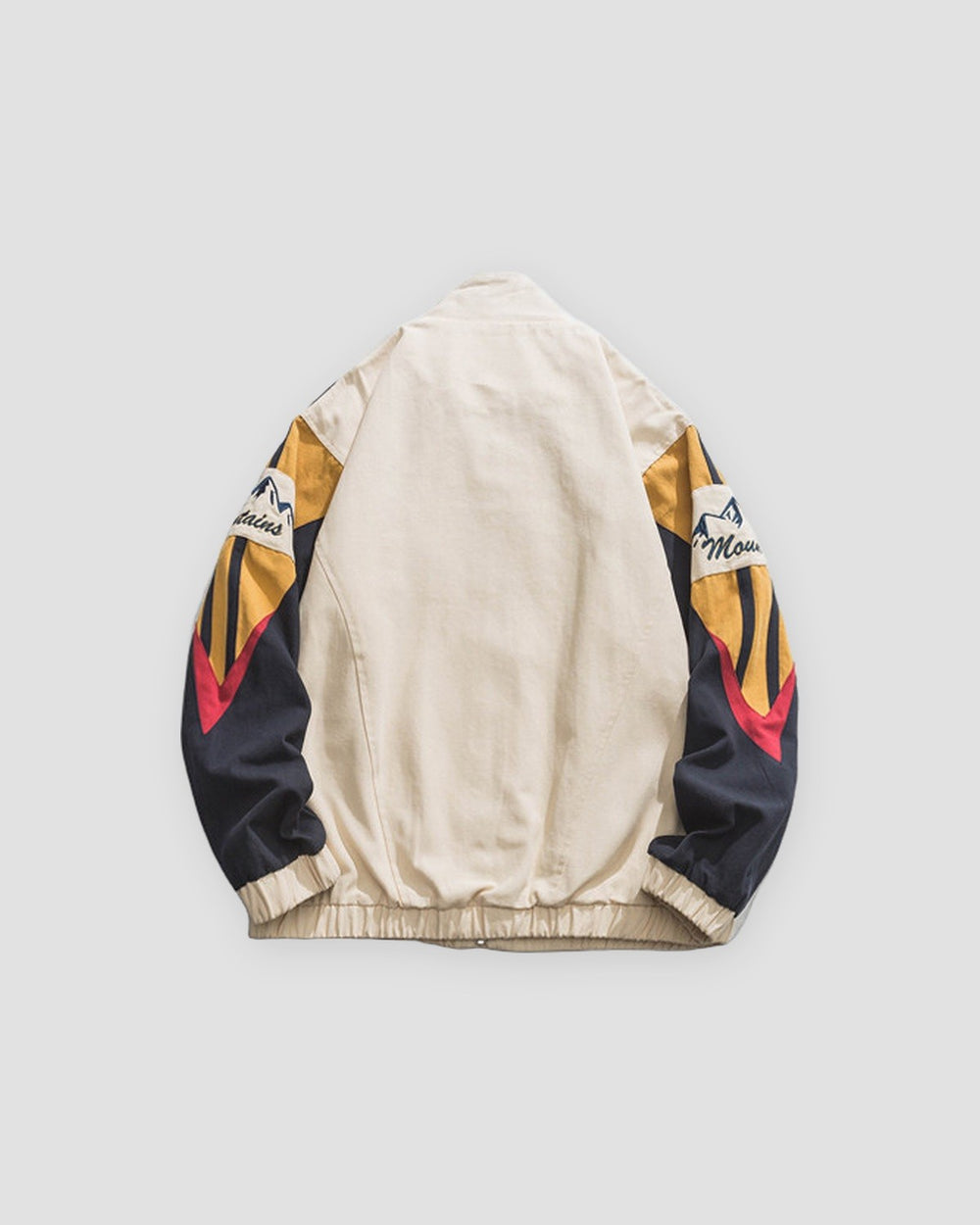 Beige color block jacket, back view of the striped raglan sleeves