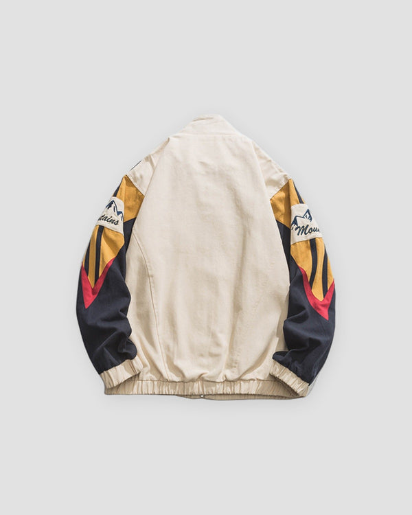 Beige color block jacket, back view of the striped raglan sleeves