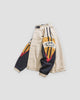 Beige color block jacket, side view of the sleeve embroidery