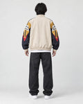 Model wearing the beige color block jacket, back view