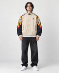 Model wearing the beige mountain color block jacket, front view
