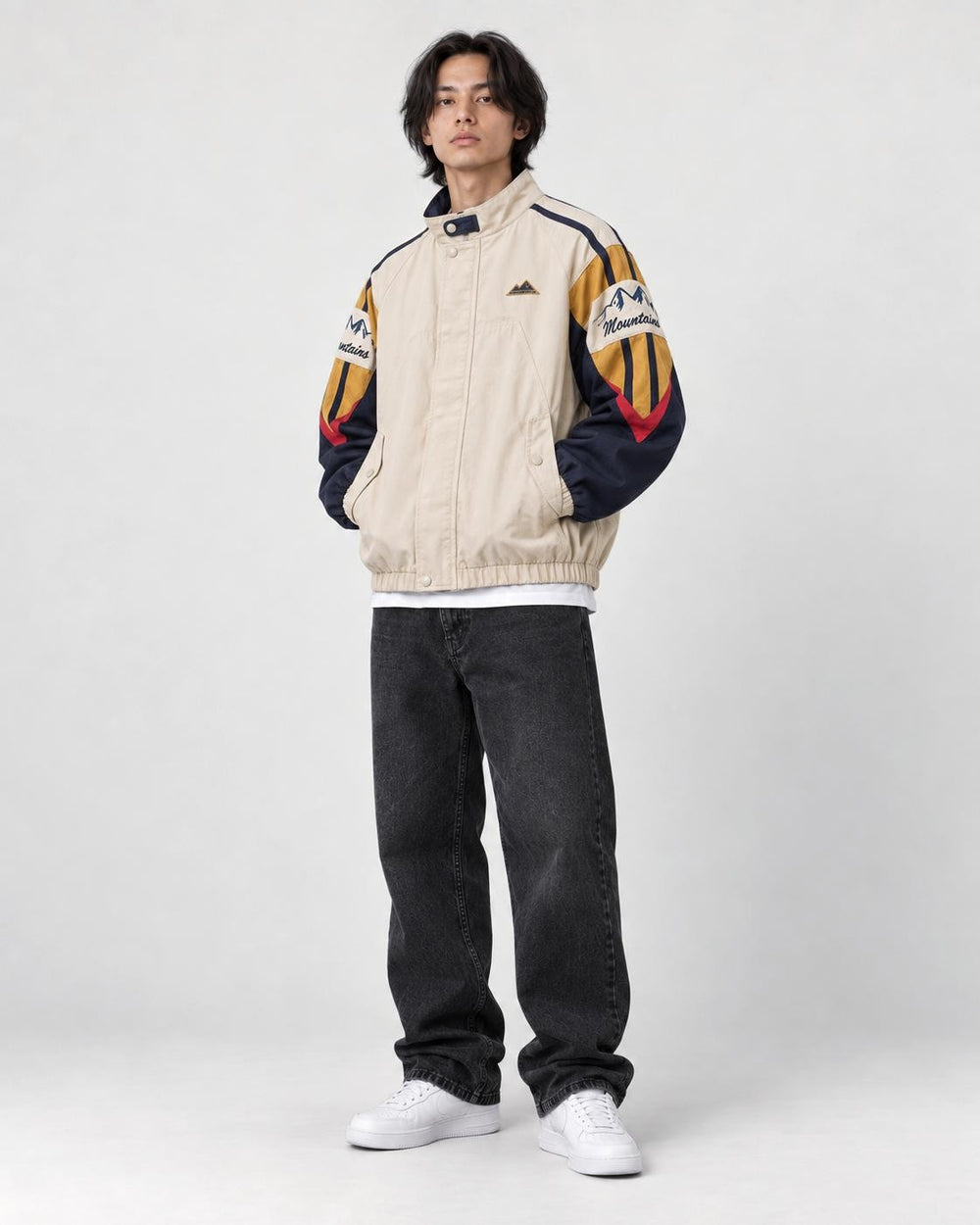 Model wearing the mountain embroidered jacket, three-quarter view