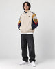 Model wearing the mountain embroidered jacket, three-quarter view