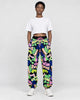 Model wearing the black-ground neon graffiti jogger pants, front view