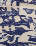 Close-up of the cream newsprint letter print on navy jersey
