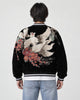 Model wearing the black kitsune sukajan, back view of the fox embroidery
