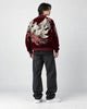 Model wearing the wine red kitsune sukajan, three-quarter back view
