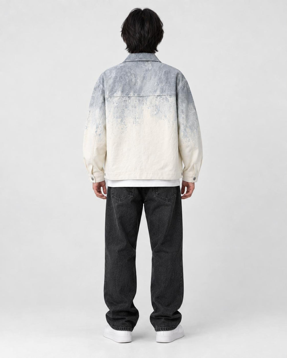 Model wearing the gray ombre shirt jacket, back view of the fade
