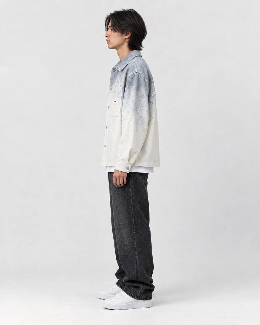 Model wearing the gray ombre shirt jacket, side view