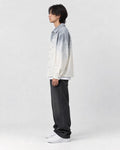 Model wearing the gray ombre shirt jacket, side view