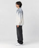Model wearing the gray ombre shirt jacket, side view