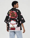 Woman in the black lucky-cat haori seen from behind at an angle, with blossoms on the sleeve