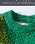 Close-up of the ribbed collar and green cable knit