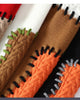 Close-up of the thick whipstitching along the patch edges