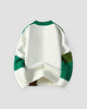 Green patchwork cable knit sweater, back view