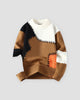 Brown patchwork cable knit sweater, front view, brown, black and orange patches on cream