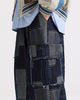 Side view of the indigo patchwork cargo pants with the wide straight leg and flap pocket