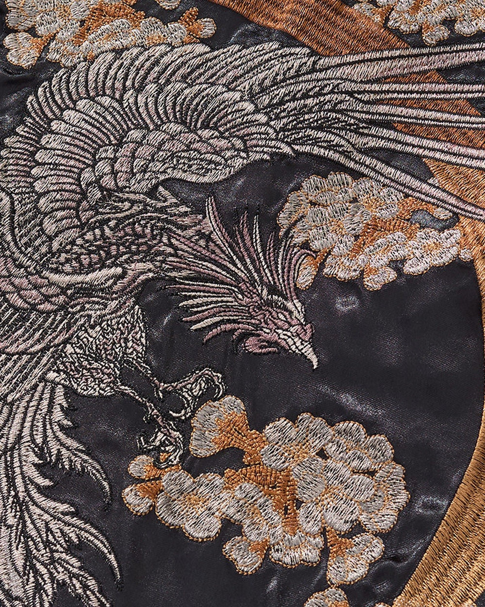 Close-up of the silver phoenix and gold cloud embroidery