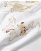 Close-up of the cream and gold phoenix embroidery on the white T-shirt