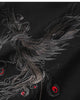 Close-up of the grey phoenix embroidery with red accents on the black T-shirt
