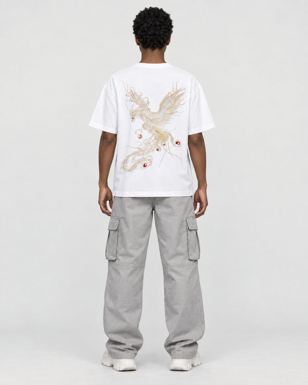 Model wearing the white phoenix embroidered T-shirt, back view