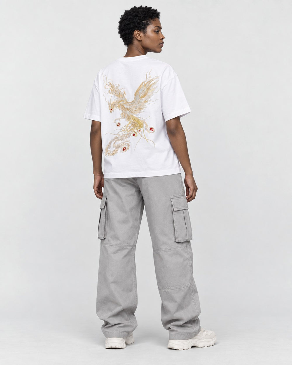 Model wearing the white phoenix embroidered T-shirt, back view over the shoulder